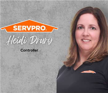 Servpro employee, woman in black polo