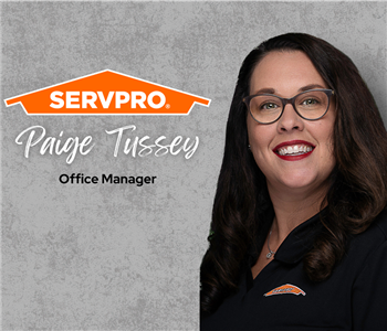 Servpro employee, woman in black polo